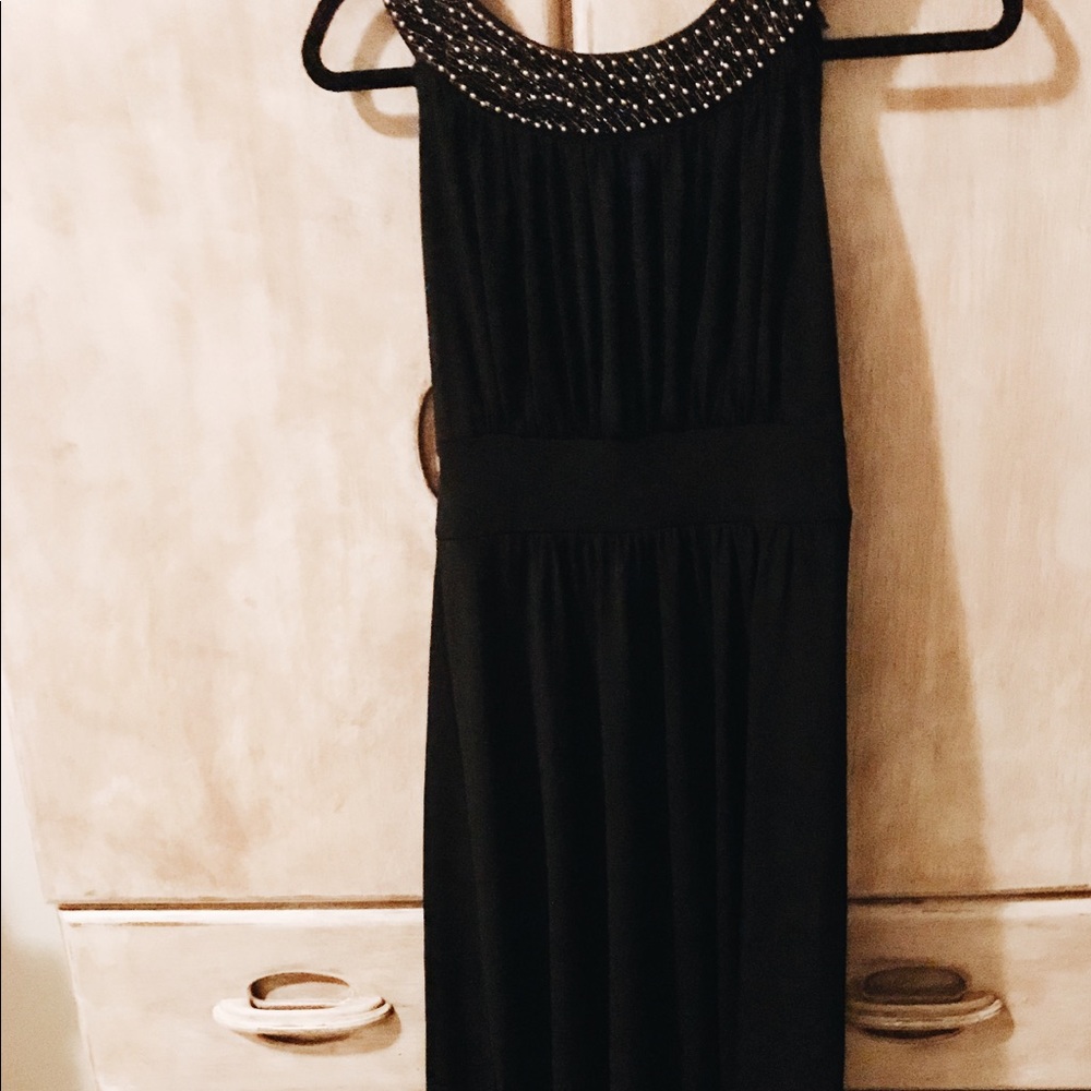 Black maxi dress with gold beading.